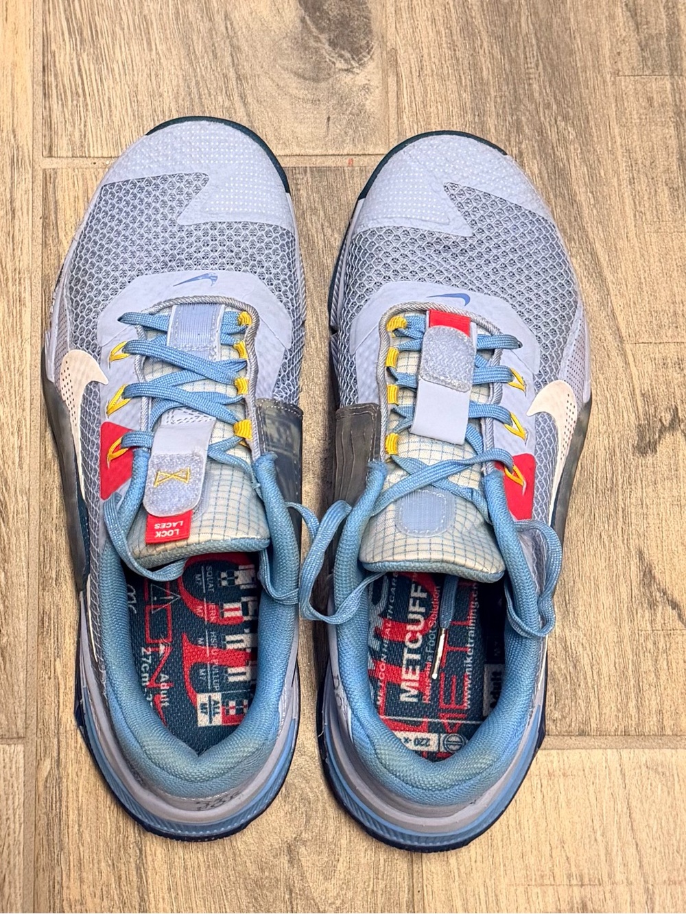 Nike Metcon 7 AMP Light Blue Athletic Sneakers with Yellow & Red Accents